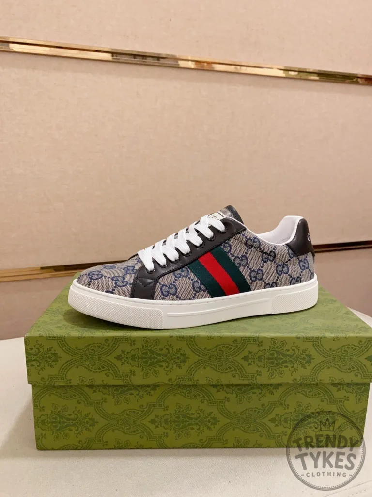 Ace Sneakers by Gucci in Monogram Canvas Featuring Web Stripe Design